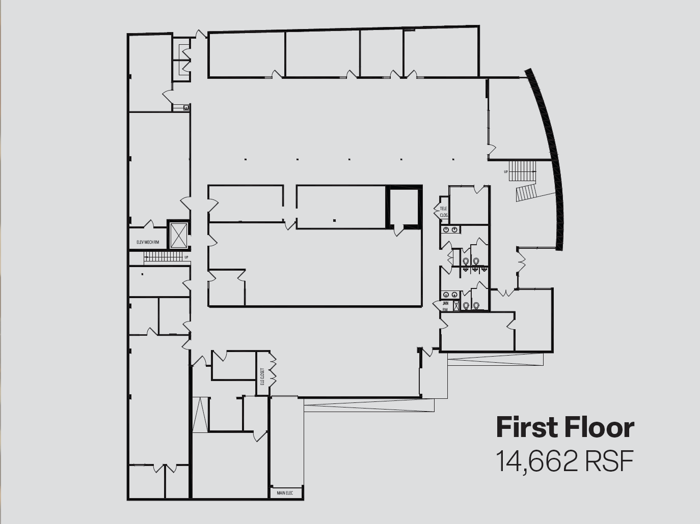 First Floor plan — 14,662 RSF. Architectural floor plan showing the dramatic lobby with exposed stair, the open showroom floor, the core with elevator, mechanical and restrooms, shipping and receiving with storage, and two dock-high loading bays.